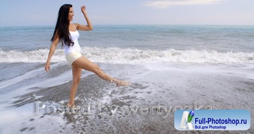 Videohive - Carefree Woman Kicking Up Water On Tropical Beach - 
11694195